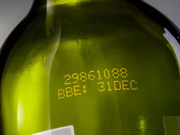 CIJ yellow ink on glass bottle