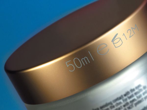 Linx CSL Laserbeschriftung auf goldenem Tiegeldeckel